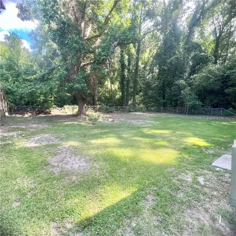 a view of a water fountain in a yard