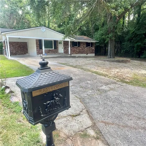 a front view of a house with yard