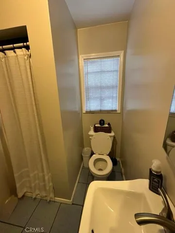 a bathroom with a sink and toilet