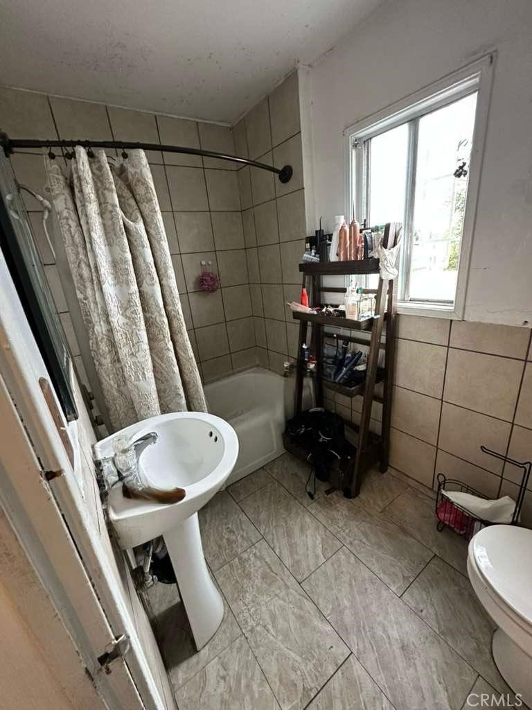 10401 State Street South Gate, CA 90280 - Photo 18 of 21 a bathroom with a sink toilet and shower