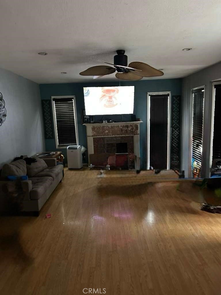 10401 State Street South Gate, CA 90280 - Photo 4 of 21 a living room with furniture and a fireplace