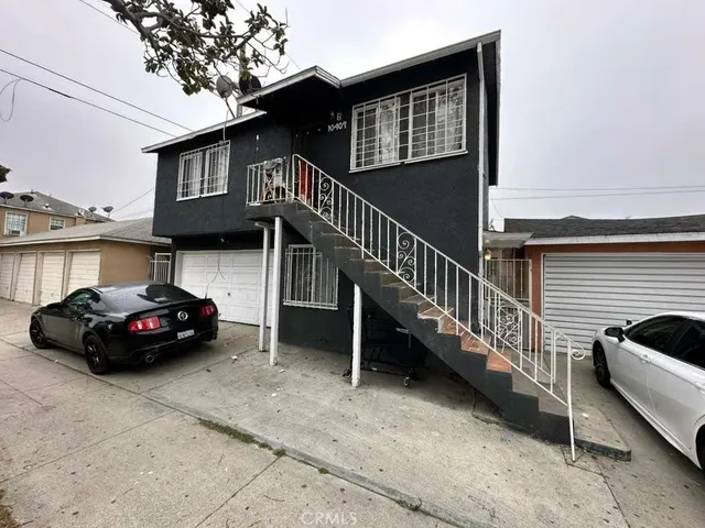 a view of a car parked in front of a house