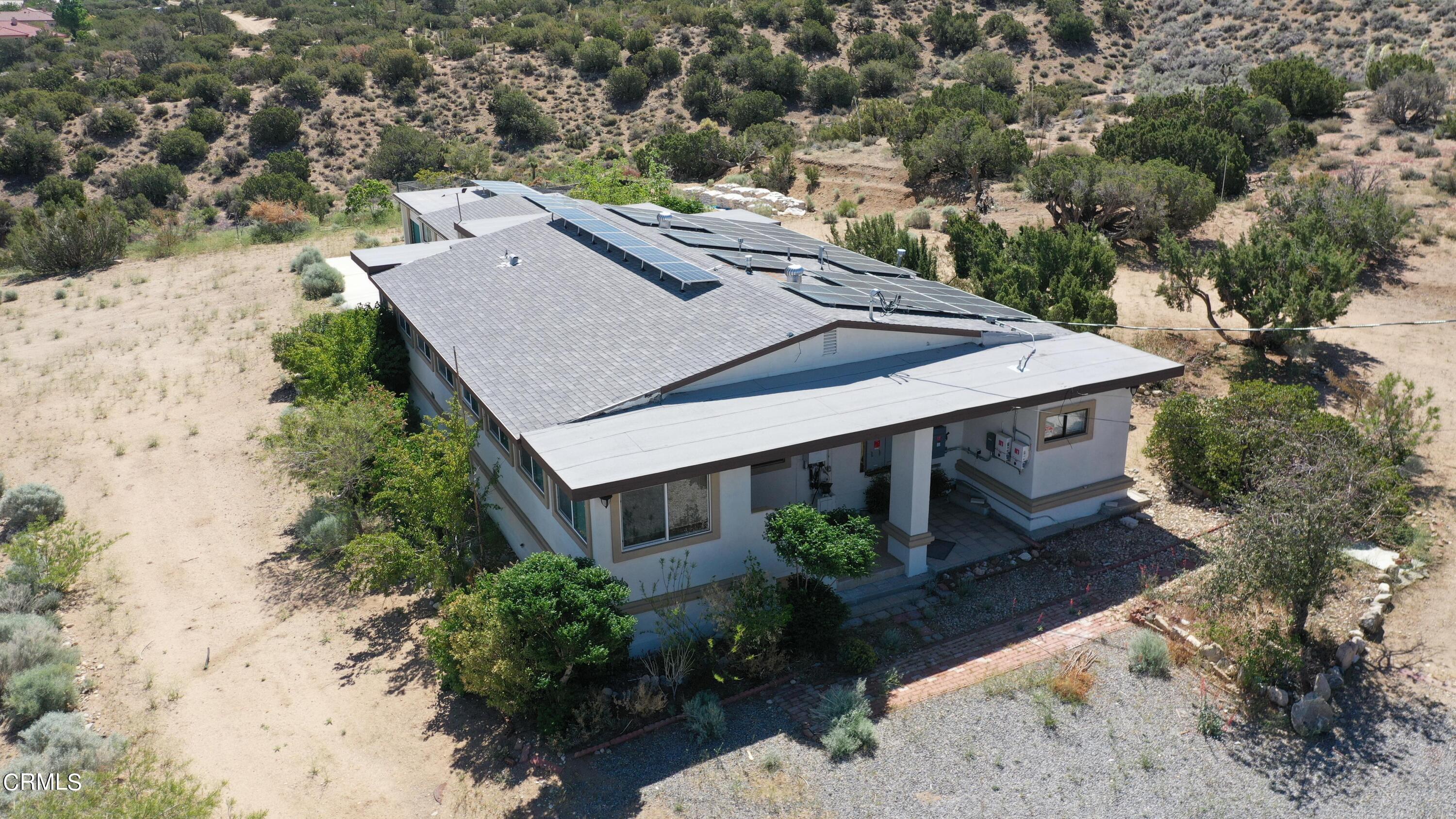 728 Nielson Road Pinon Hills, CA 92372 - Photo 1 of 50 an aerial view of a house with yard and mountain view in back