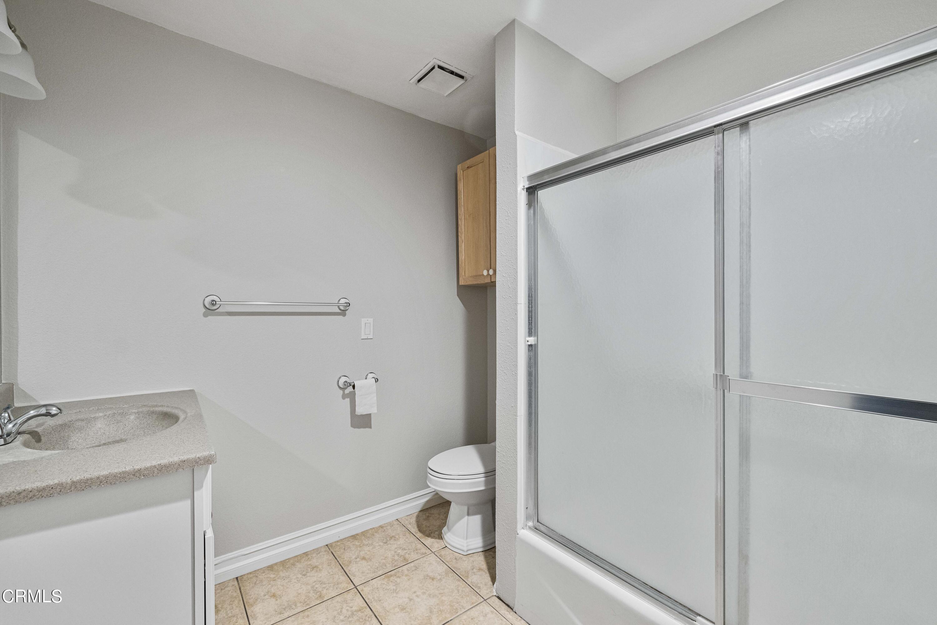 728 Nielson Road Pinon Hills, CA 92372 - Photo 34 of 50 a bathroom with a granite countertop sink toilet and shower