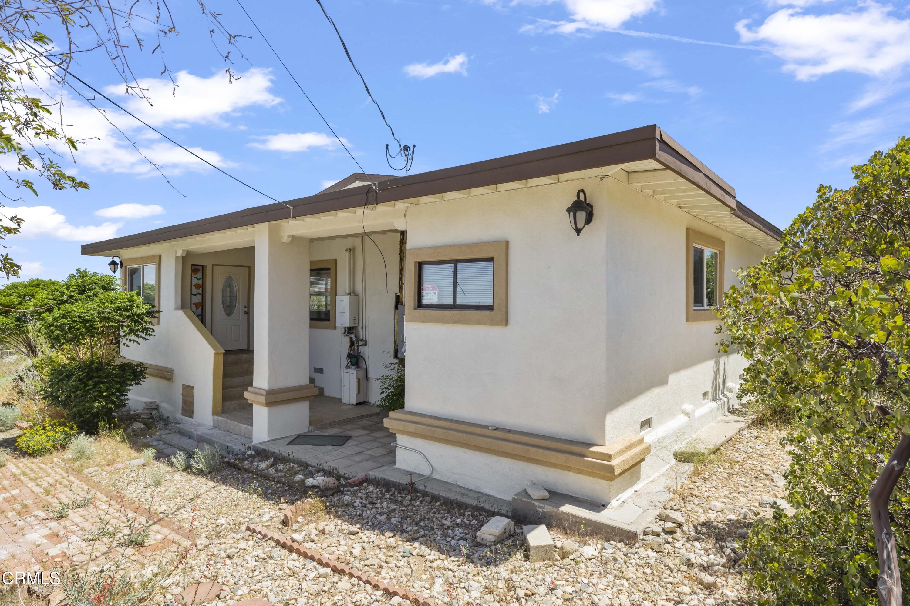 728 Nielson Road Pinon Hills, CA 92372 - Photo 4 of 50 a front view of a house with garden