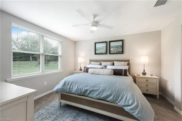 a kitchen with stainless steel appliances granite countertop a table and chairs
