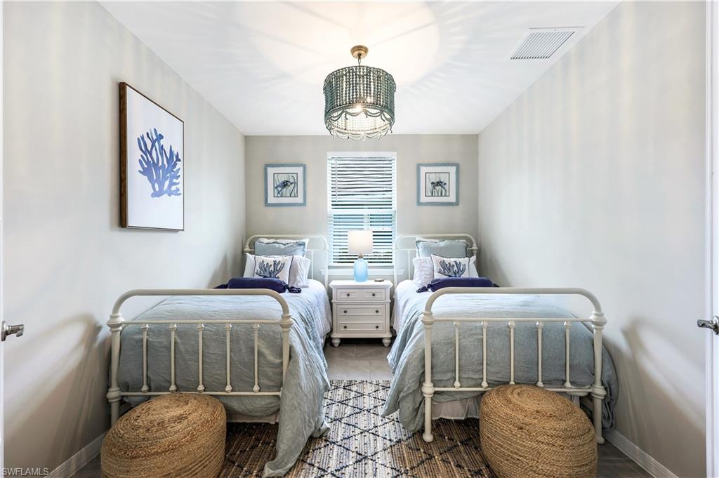 14551 Edgewater Circle Naples, FL 34114 - Photo 18 of 26 Bedroom with baseboards