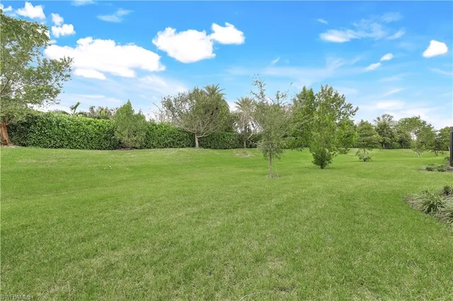 a view of house with backyard