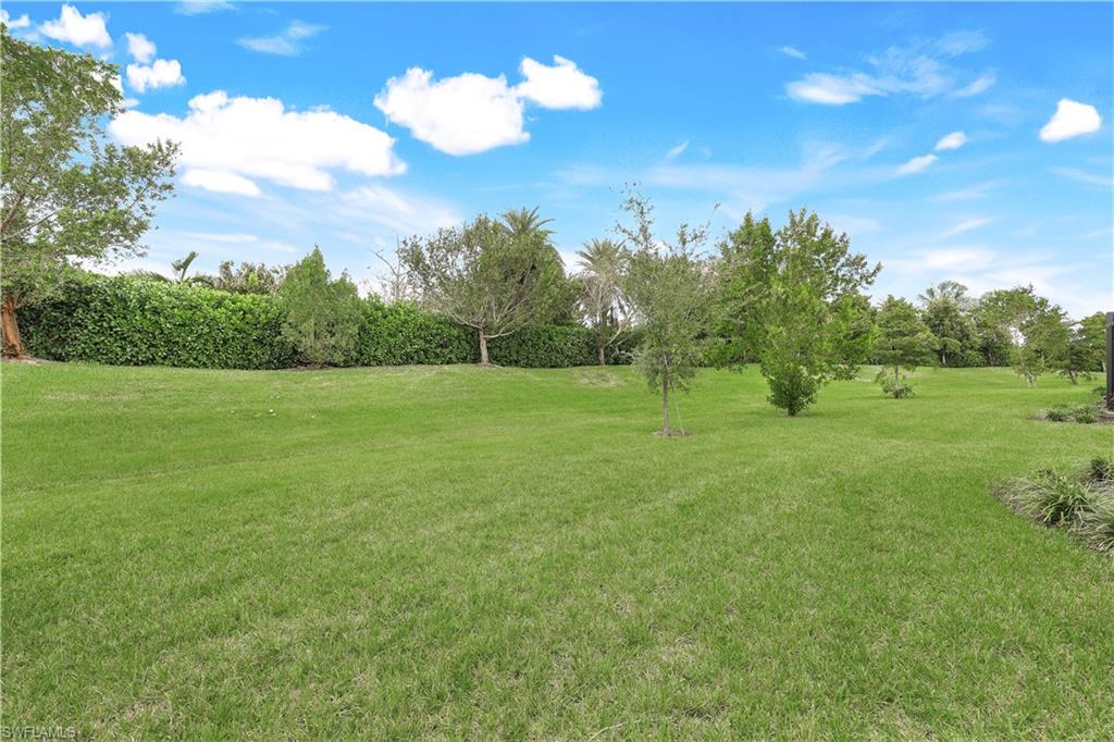 14551 Edgewater Circle Naples, FL 34114 - Photo 24 of 26 View of green lawn