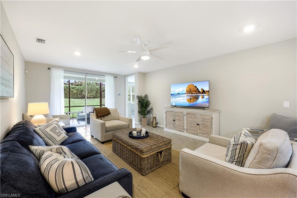 14551 Edgewater Circle Naples, FL 34114 - Photo 5 of 26 Living area with recessed lighting and a ceiling fan