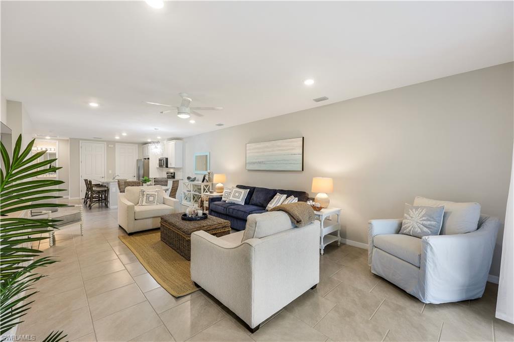 14551 Edgewater Circle Naples, FL 34114 - Photo 7 of 26 Living area featuring recessed lighting, ceiling fan, and light tile patterned floors