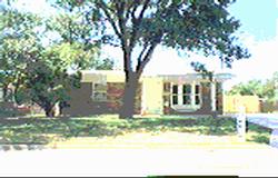 1404 Southwest 48th Avenue Amarillo, TX 79110 - Photo 1 of 1 a view of house in front of a yard with plants and large trees
