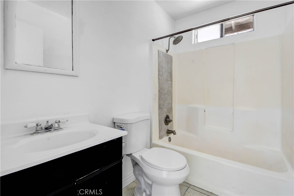 4039 Lorraine Drive, Unit 5 San Bernardino, CA 92407 - Photo 13 of 15 a bathroom with a sink toilet and shower