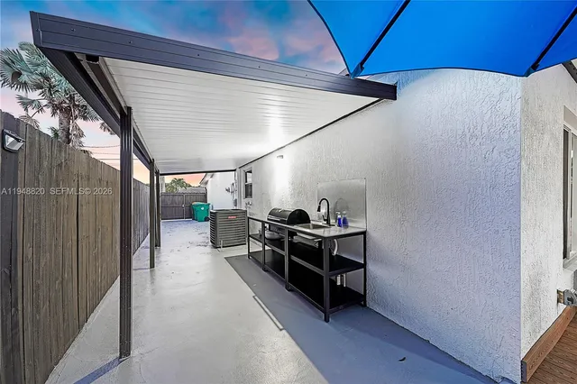 a view of a hallway with seating area