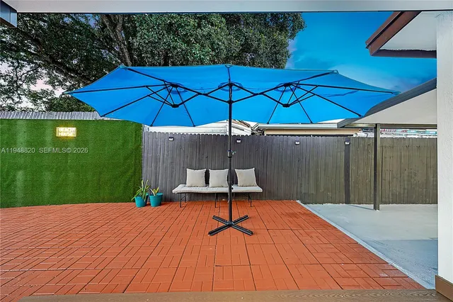 an outdoor space with pool and furniture