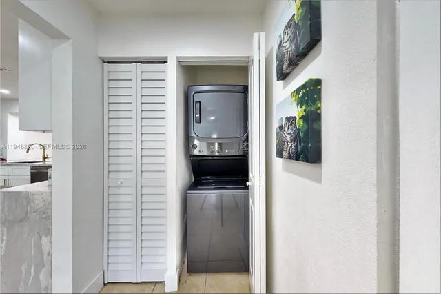 a view of hallway with washer and dryer
