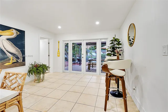 a view of a room with furniture and a potted plant