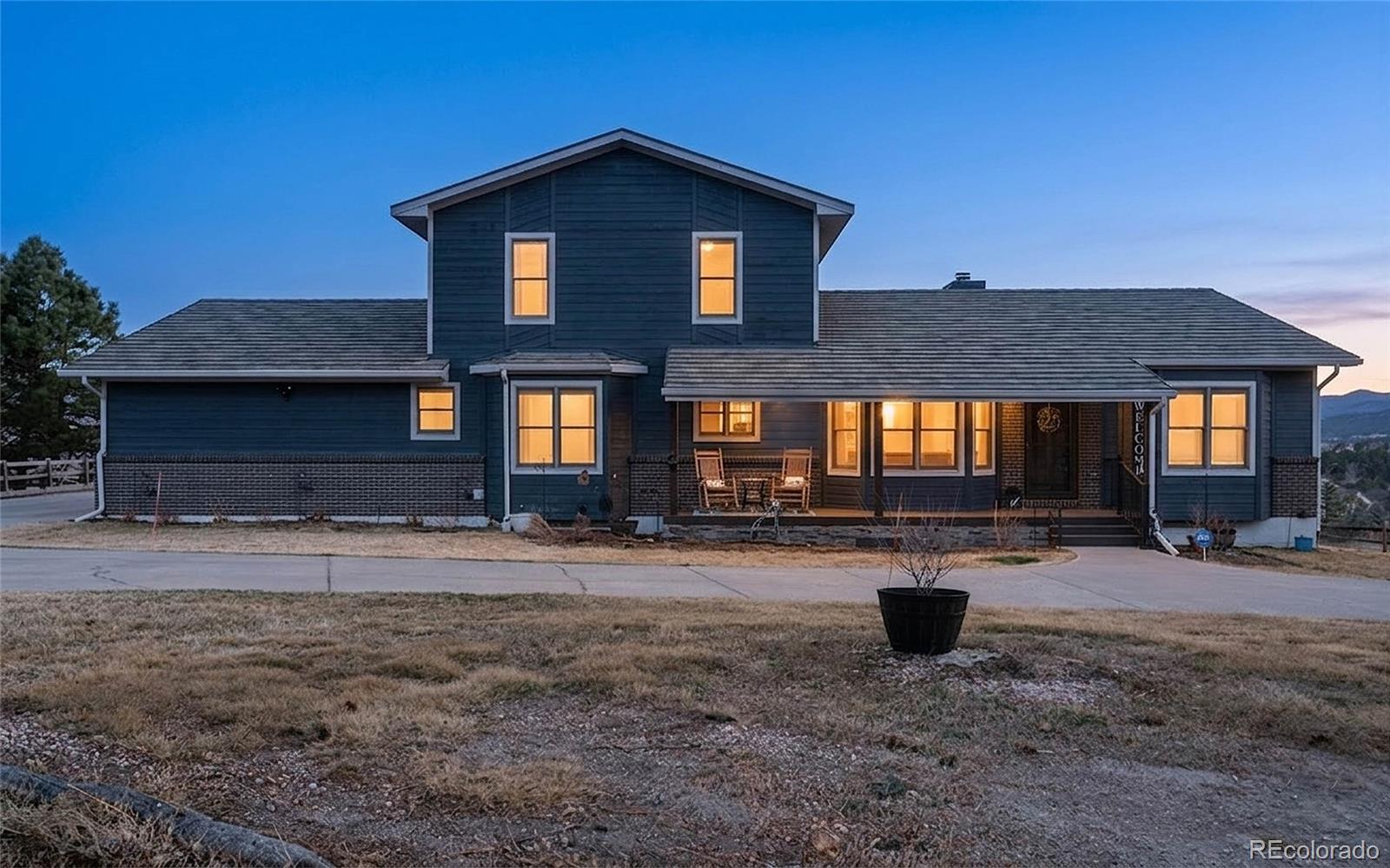 17840 New London Road Monument, CO 80132 - Photo 1 of 47 a front view of a house with a yard