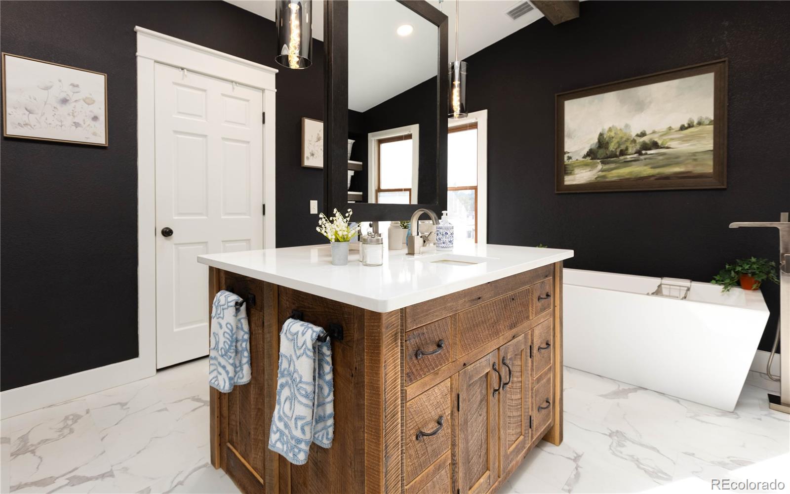 17840 New London Road Monument, CO 80132 - Photo 12 of 47 a bathroom with a sink double vanity and a mirror