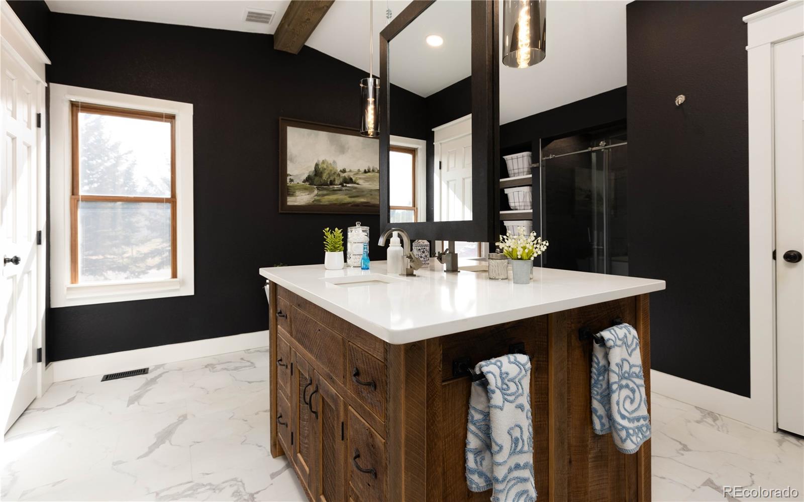 17840 New London Road Monument, CO 80132 - Photo 13 of 47 a bathroom with a sink vanity and a mirror