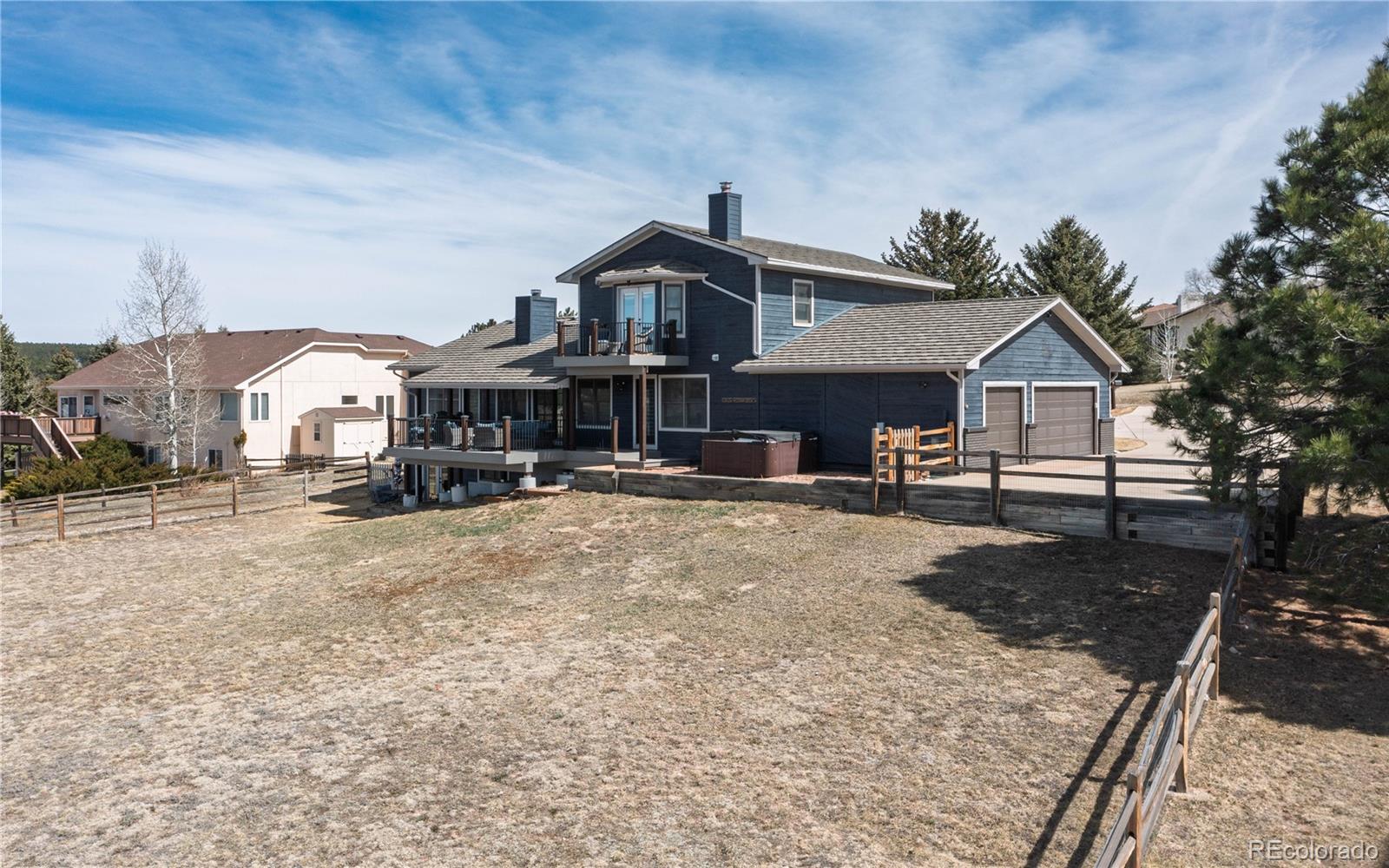 17840 New London Road Monument, CO 80132 - Photo 29 of 47 a front view of a house with a yard
