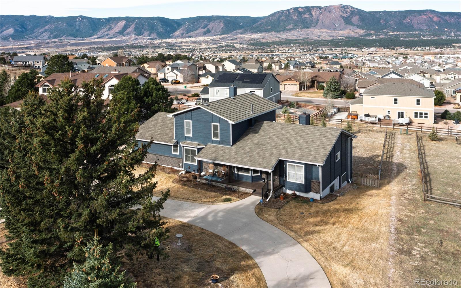 17840 New London Road Monument, CO 80132 - Photo 36 of 47 an aerial view of a house with a yard wooden table and chairs