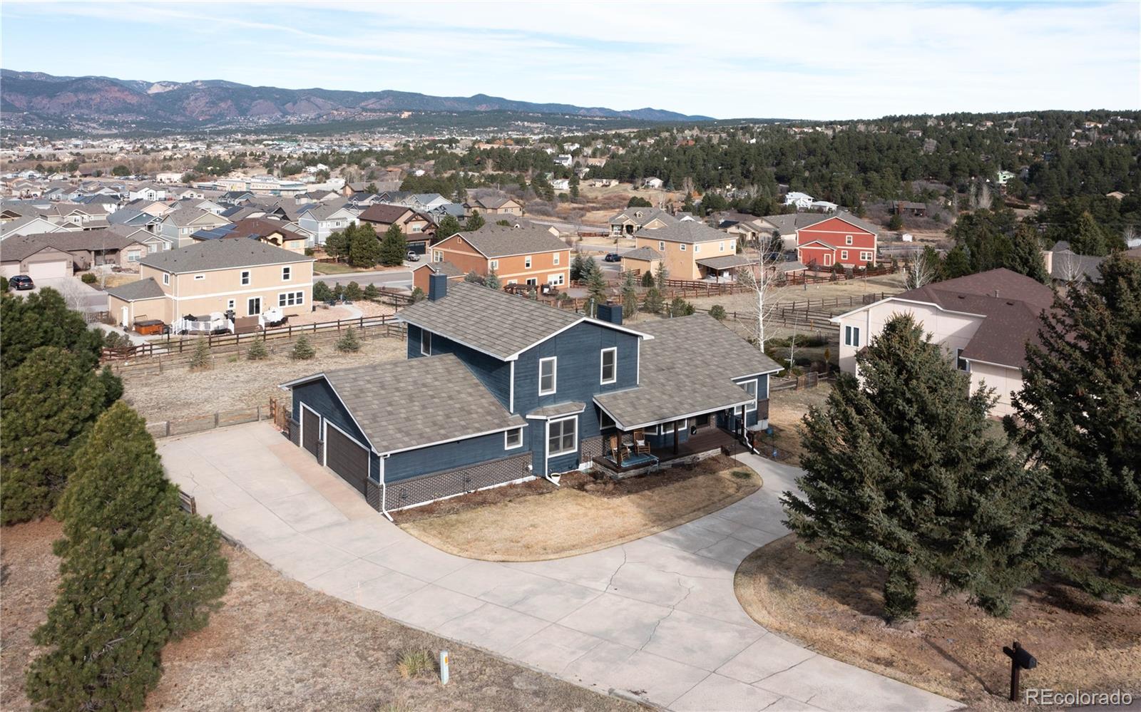 17840 New London Road Monument, CO 80132 - Photo 37 of 47 a view of a house with a yard