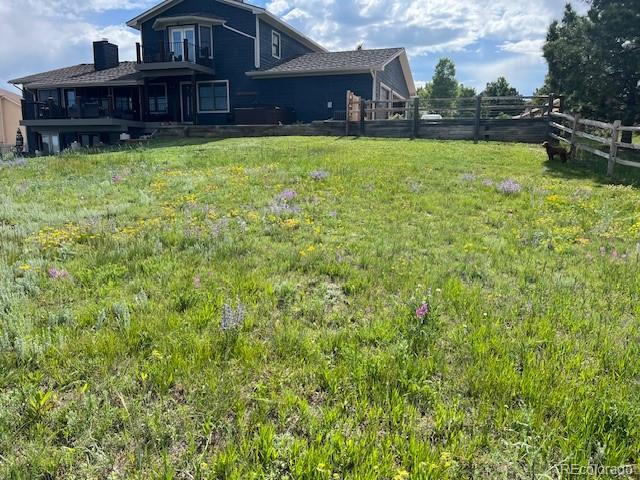 17840 New London Road Monument, CO 80132 - Photo 46 of 47 a view of a house with a yard and sitting area