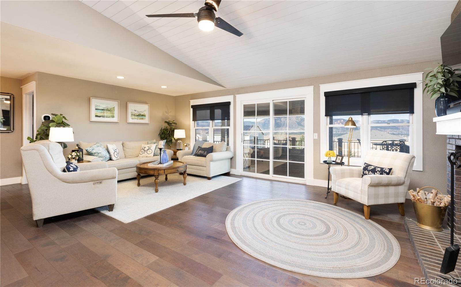 17840 New London Road Monument, CO 80132 - Photo 6 of 47 a living room with furniture and a large window