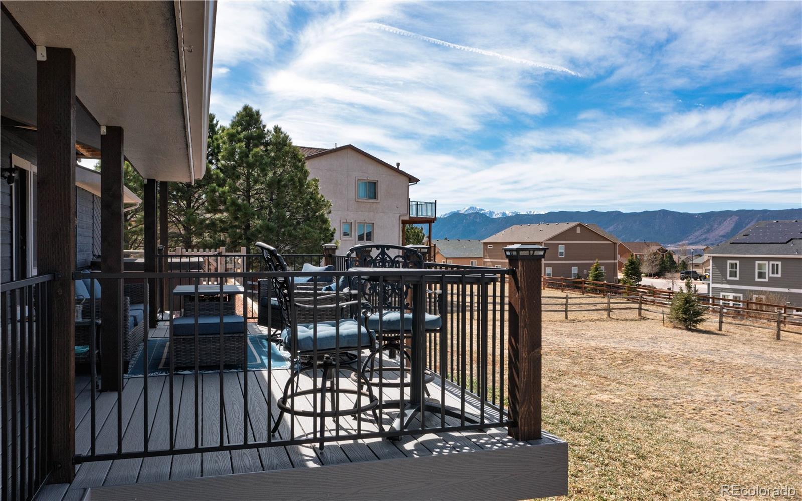17840 New London Road Monument, CO 80132 - Photo 10 of 47 a view of a roof deck with table and chairs with wooden floor