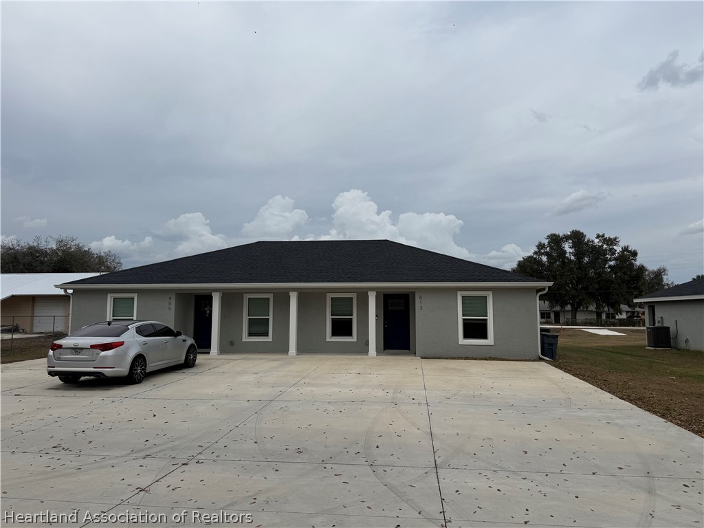 809 Redding Street Zolfo Springs, FL 33890 - Photo 2 of 8 a car parked in front of house