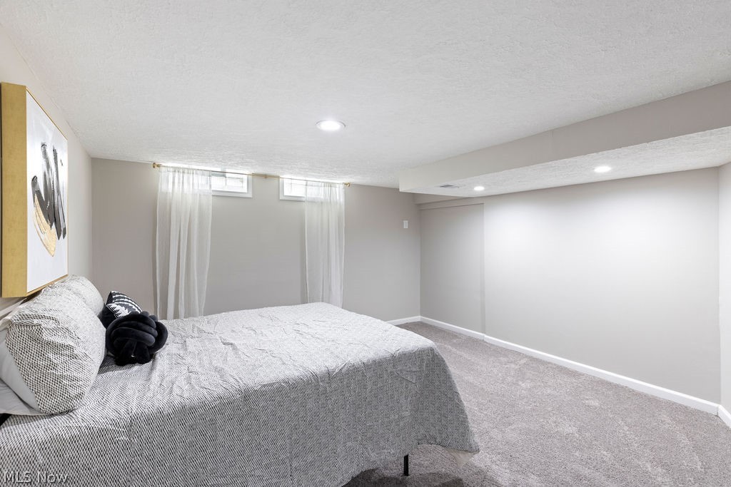 9620 David Road Garfield Heights, OH 44125 - Photo 29 of 36 Bedroom featuring carpet and a textured ceiling
