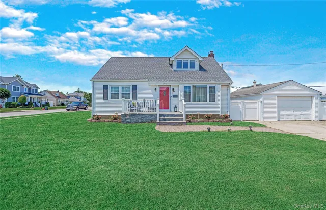 a front view of house with yard and green space
