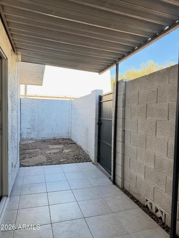 a view of a balcony with a potted plant