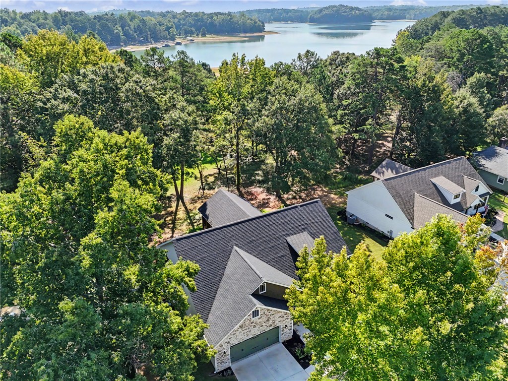 701 Coneross Creek Road Seneca, SC 29678 - Photo 34 of 35 Surrounded by trees with Lake Hartwell just beyond, this is a place to slow down, enjoy the water and make the most of lake life.