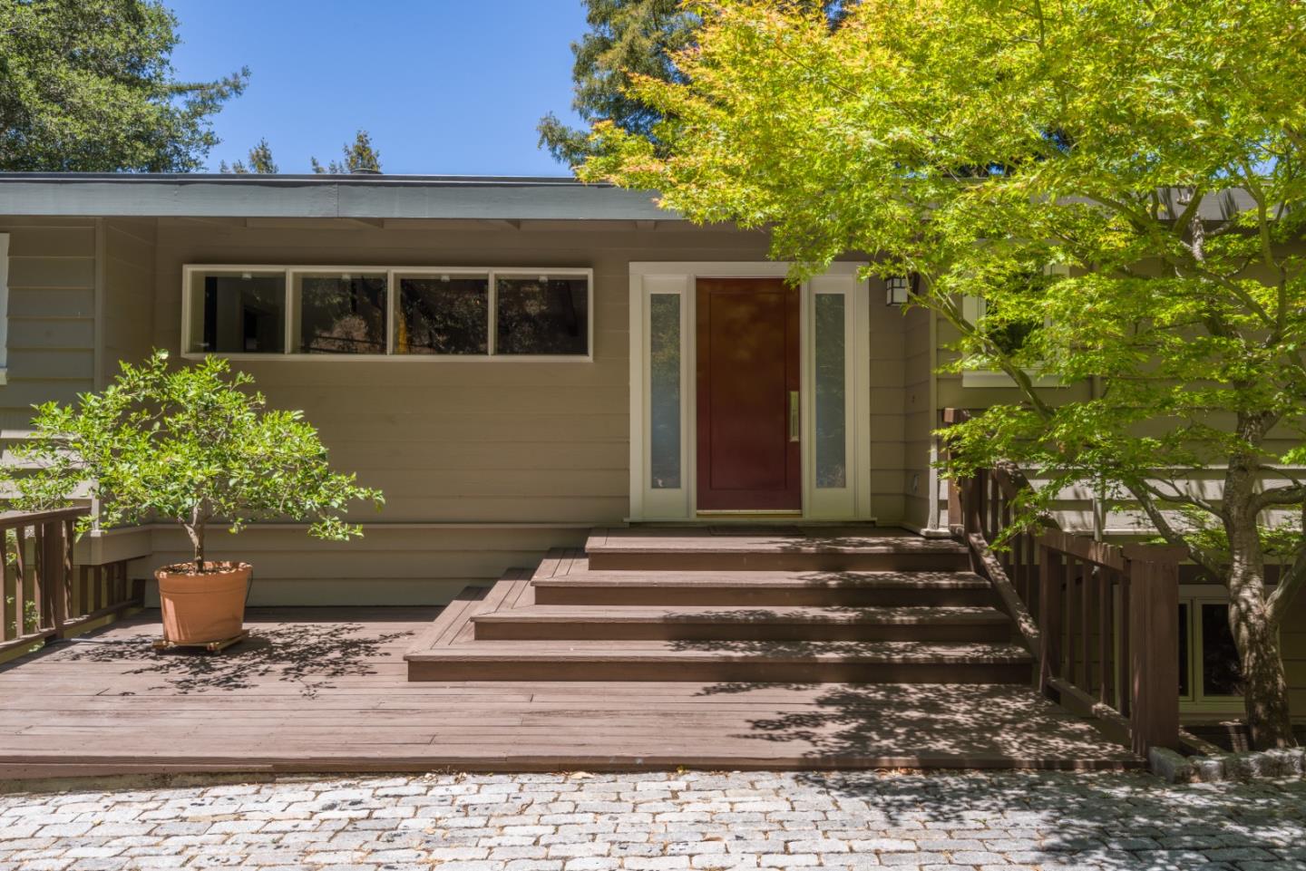 790 Patrol Road Woodside, CA 94062 - Photo 1 of 26 a view of a house with potted plants