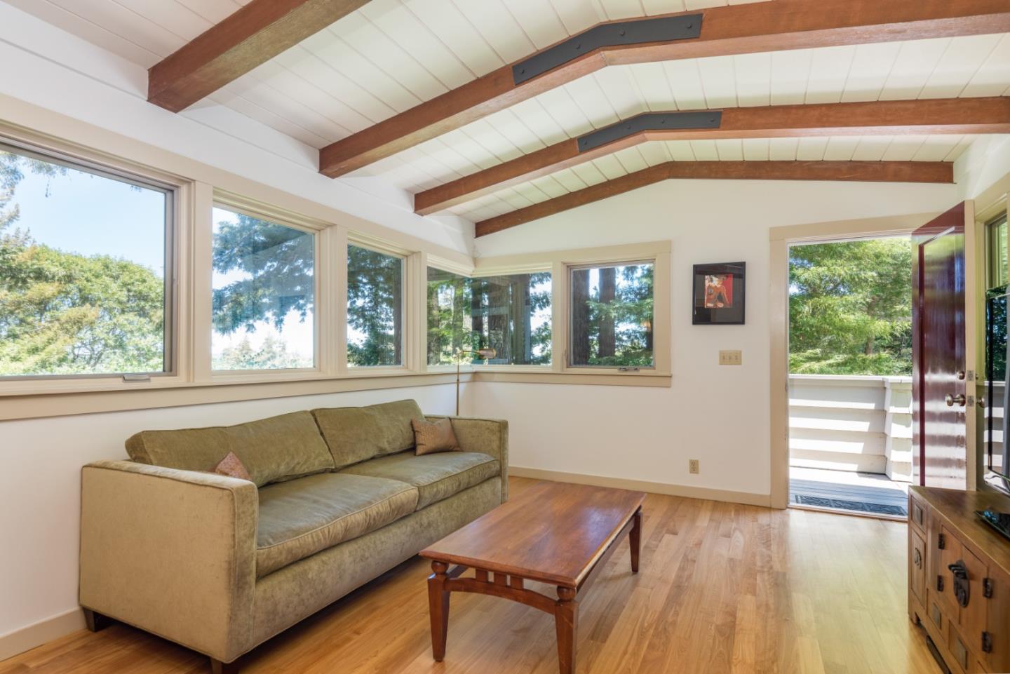 790 Patrol Road Woodside, CA 94062 - Photo 11 of 26 a living room with furniture and a large window