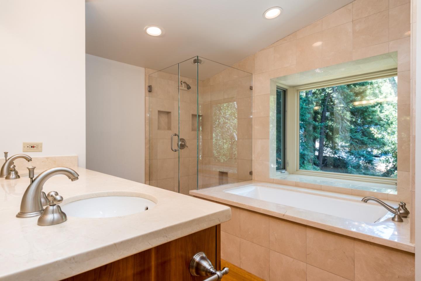 790 Patrol Road Woodside, CA 94062 - Photo 14 of 26 a spacious bathroom with a sink a shower and a large mirror