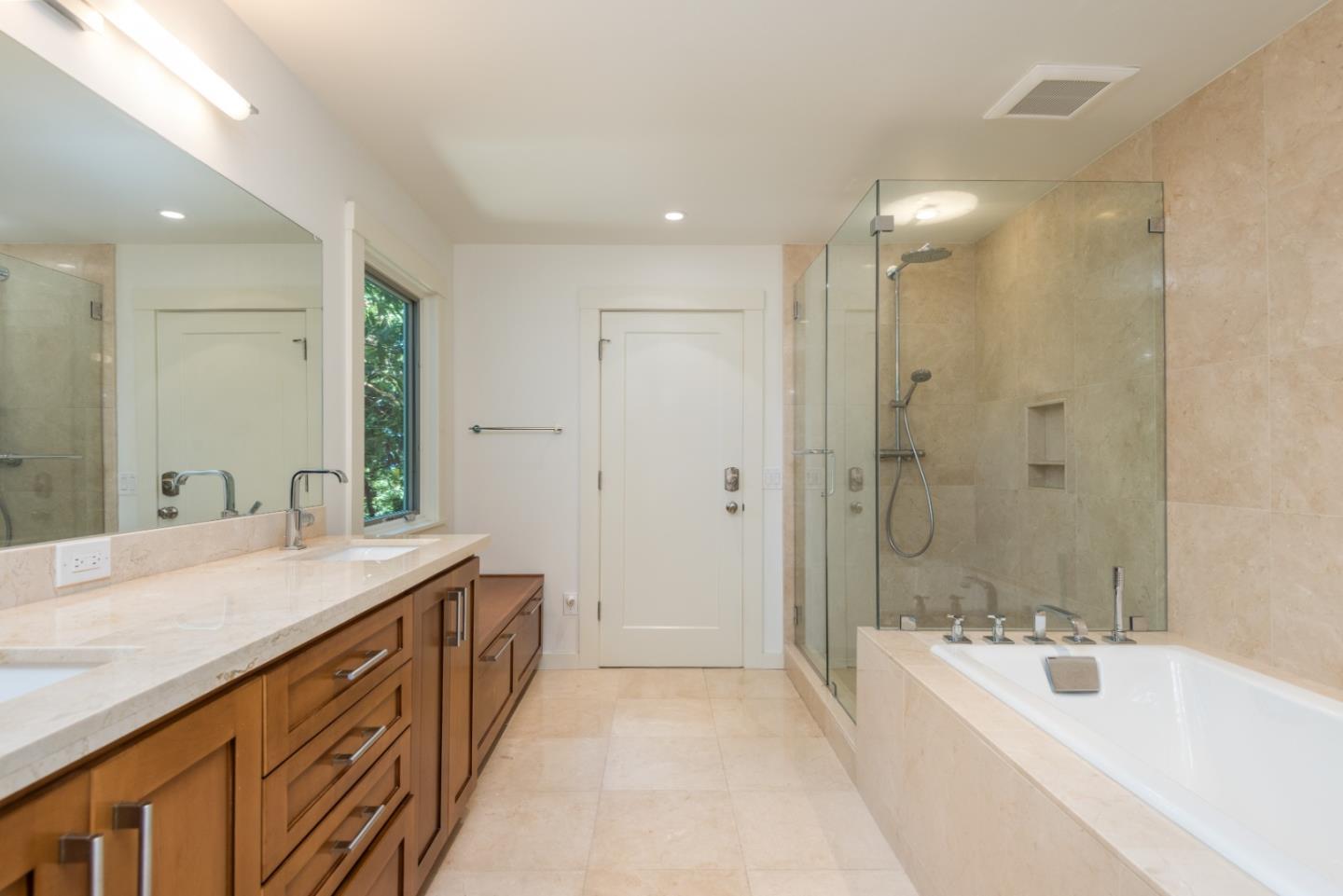 790 Patrol Road Woodside, CA 94062 - Photo 17 of 26 a spacious bathroom with a bathtub shower sink and mirror
