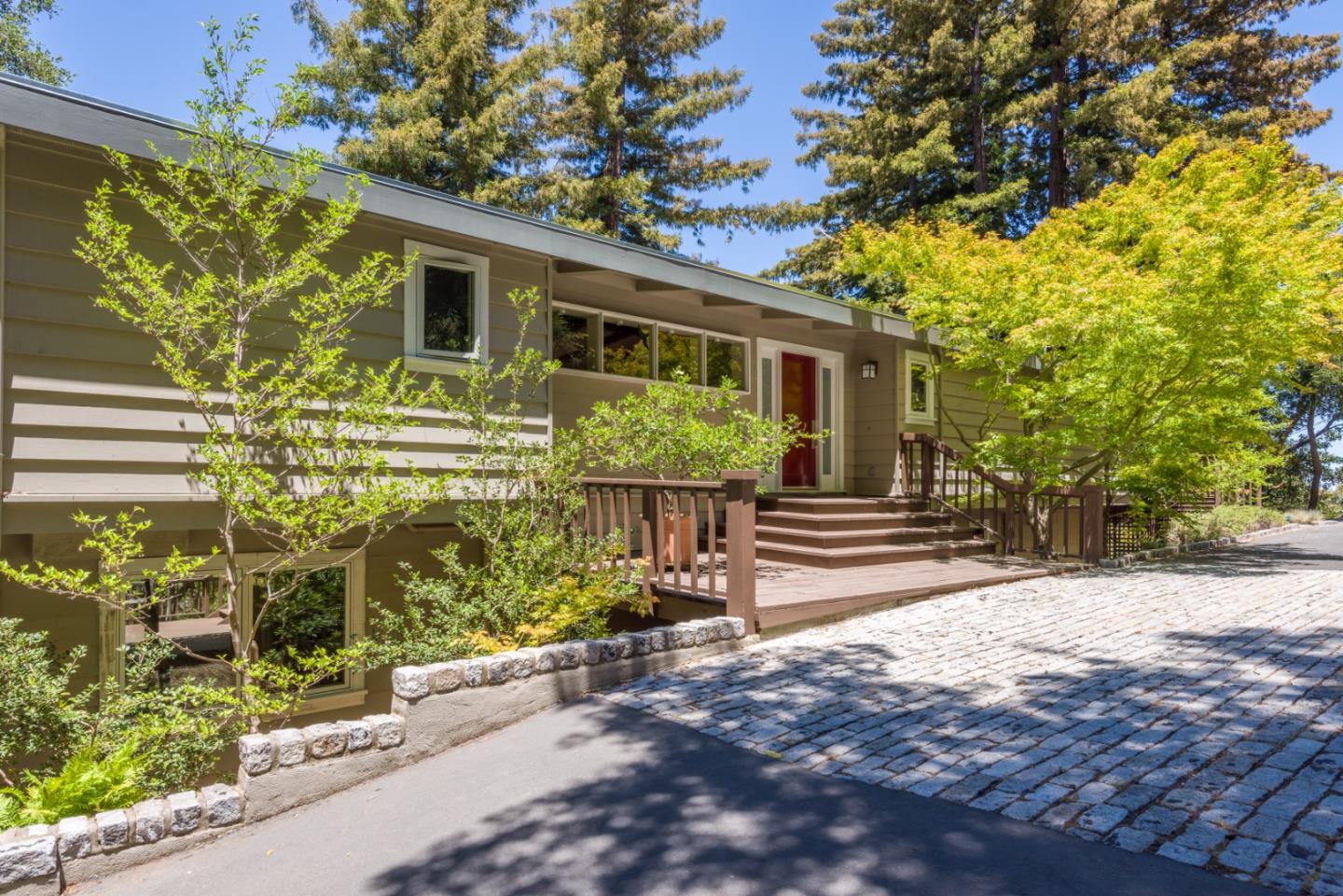 790 Patrol Road Woodside, CA 94062 - Photo 3 of 26 a front view of a house with garden