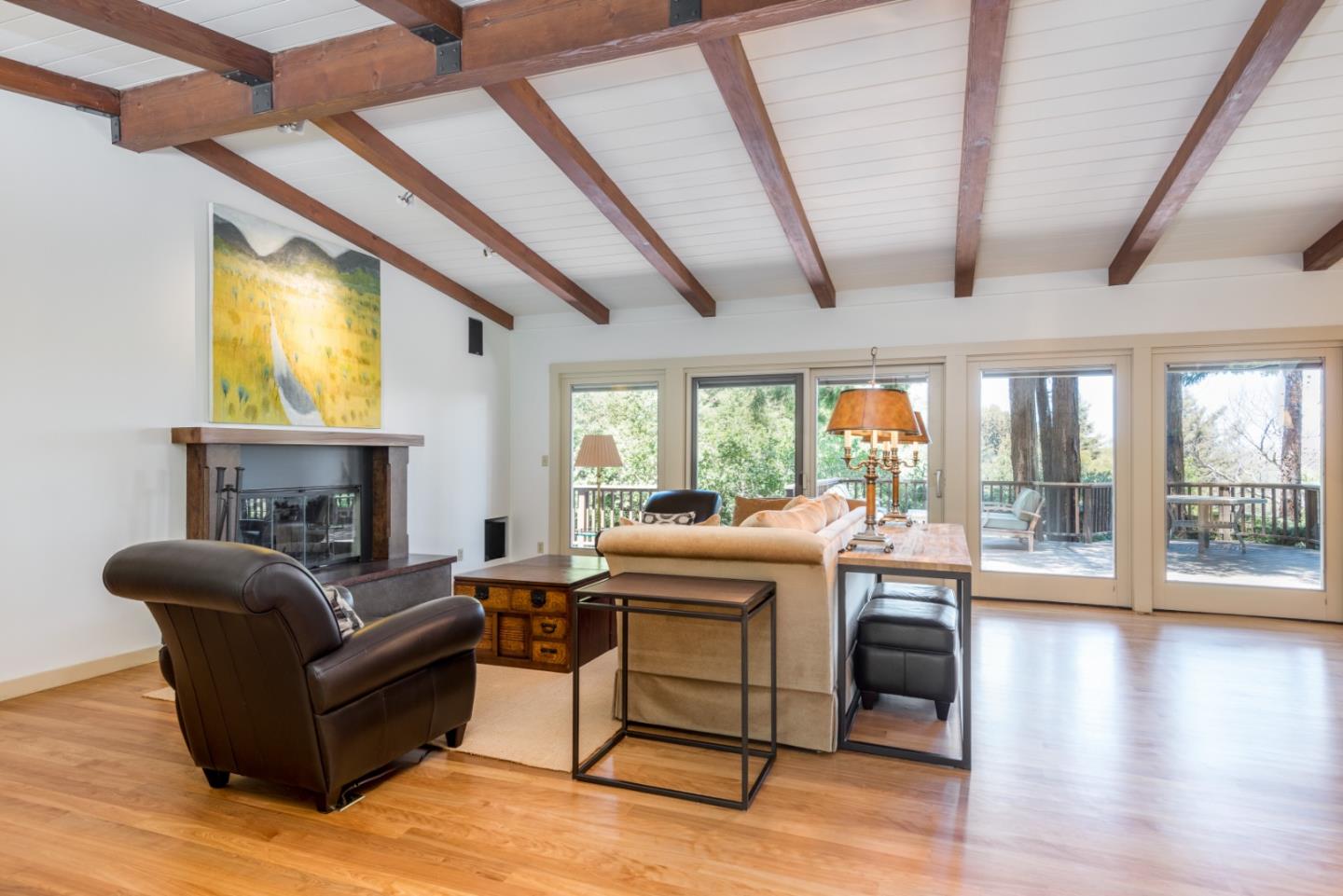 790 Patrol Road Woodside, CA 94062 - Photo 5 of 26 a living room with furniture and a floor to ceiling window