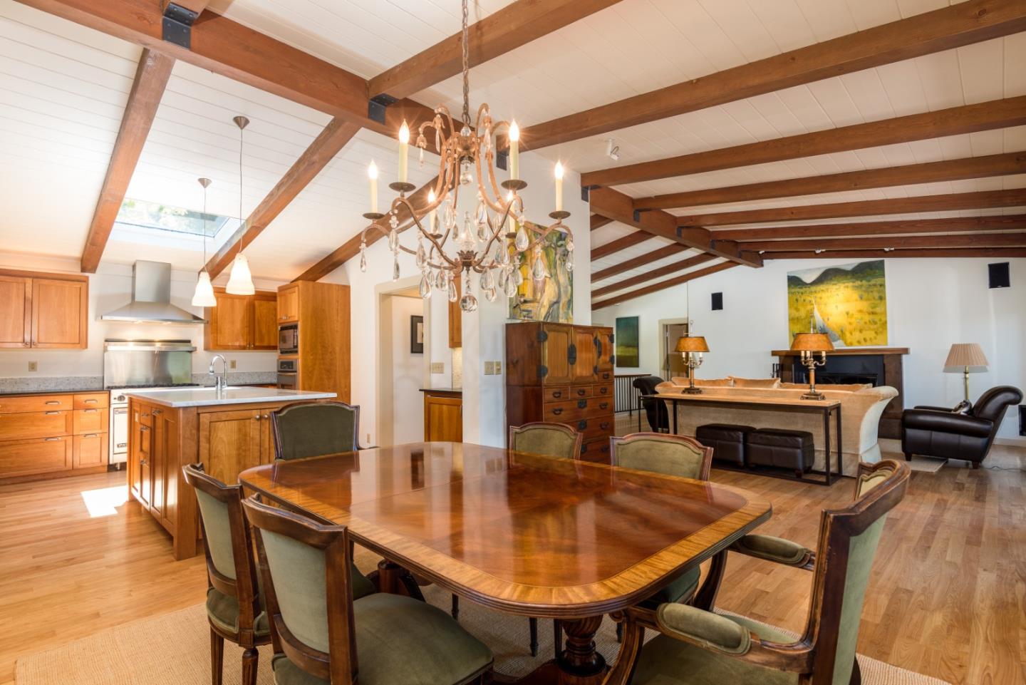 790 Patrol Road Woodside, CA 94062 - Photo 8 of 26 a dining room with furniture a chandelier and wooden floor