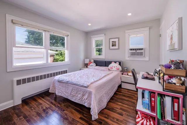 a bed room with bed and a window