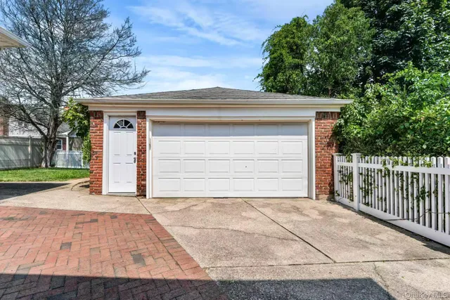 a small white house with a outdoor space
