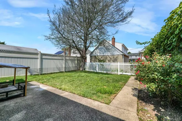 a view of backyard with green space
