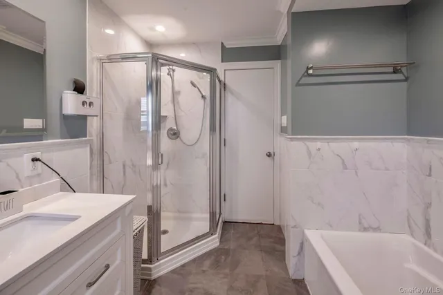 a bathroom with a granite countertop sink a shower and a mirror