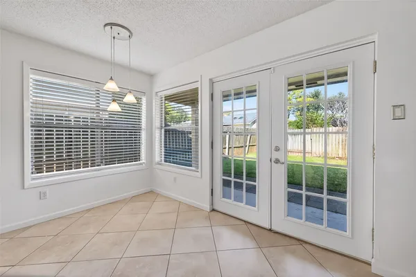 a view of an empty room with glass windows