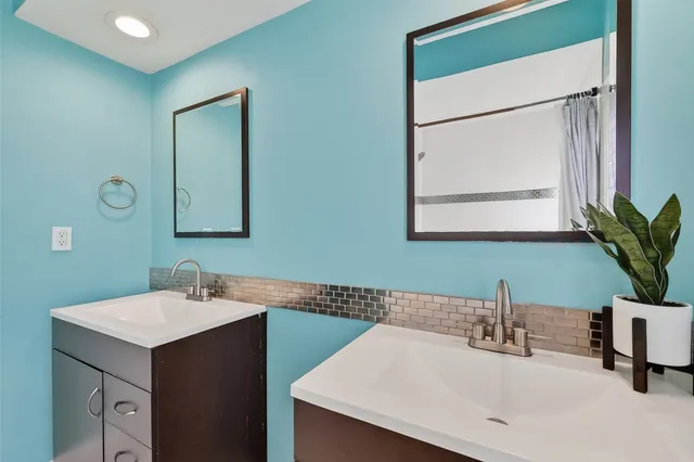 a bathroom with a sink and a mirror