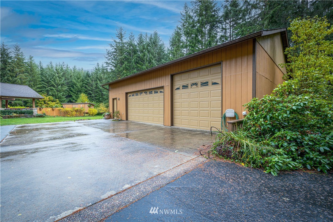 249 Coma Road Winlock, WA 98596 - Photo 2 of 38 a view of a house with a yard and garage
