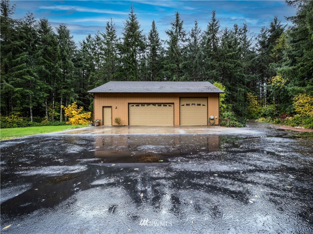 249 Coma Road Winlock, WA 98596 - Photo 3 of 38 a house with trees in the background